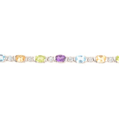 Lot 351 - A "rainbow" coloured stone bracelet.