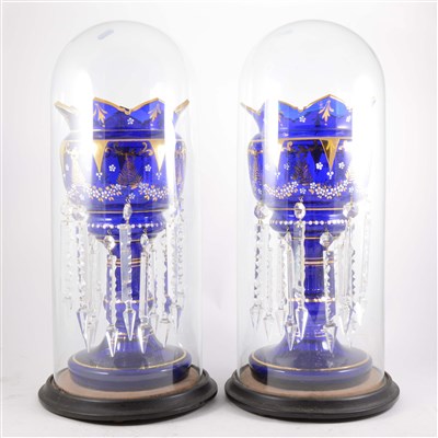 Lot 10 - A pair of Victorian blue glass lustre vases