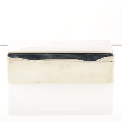 Lot 203 - A silver cigarette box by Walker & Hall, wood-lined, slightly domed engine-turned lid, Sheffield 1922, 17.5cm width.