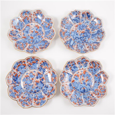 Lot 20 - Four Imari shallow bowls, lotus leaf shape, decorated in blue and iron red.