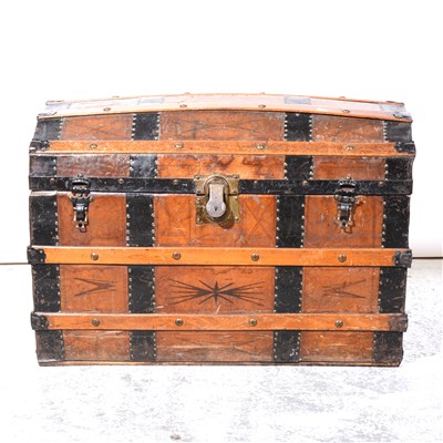 Lot 356 - Vintage leather and metal strapped dome-topped trunk.