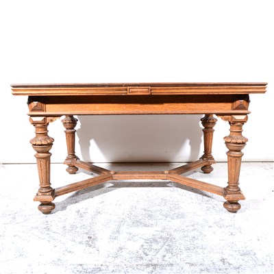 Lot 317 - A suite of German carved oak dining room furniture