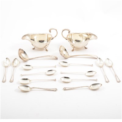 Lot 250 - A pair of silver sauceboats by William Neale & Son Ltd., flying scroll handle, on three stepped hoof feet,a set of six teaspoons by Frederick C Asman & Co, Sheffield 1913, and a set of six teaspoons