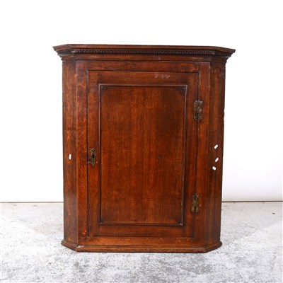 Lot 407 - George III oak hanging corner cupboard