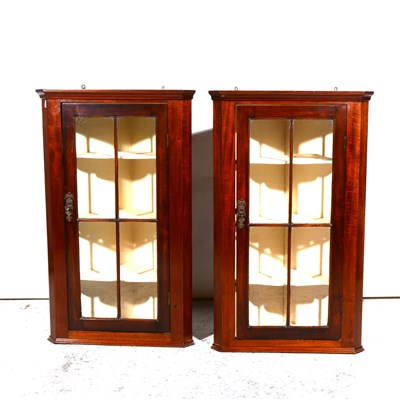 Lot 347 - Pair of Edwardian mahogany hanging corner cabinets.
