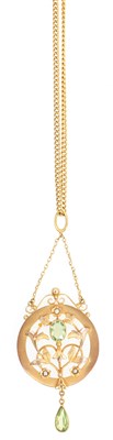 Lot 221 - An Edwardian  peridot and seed pearl pendant and chain.
