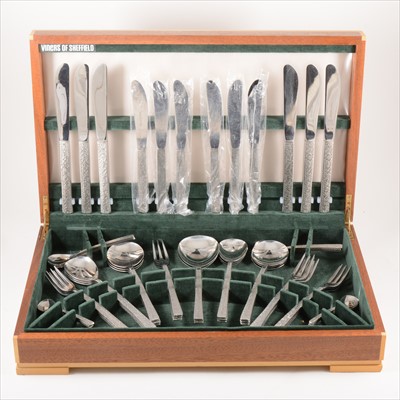 Lot 196 - A canteen of 'Bark' effect stainless-steel, by Gerald Benney for Viners Studio, circa 1960.