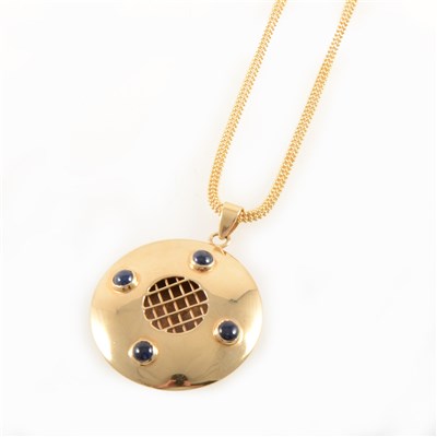 Lot 312 - A yellow metal pendant and chain set with four cabochon cut stones.