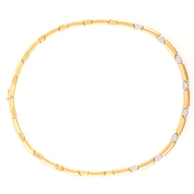 Lot 241 - A yellow and white metal necklace marked 750