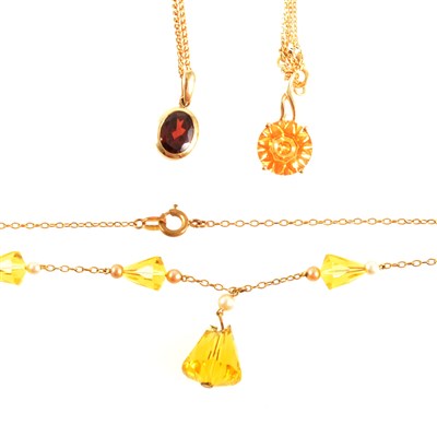Lot 315 - Three yellow metal necklaces with stones.