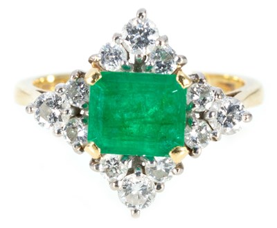 Lot 206 - An emerald and diamond cluster ring.