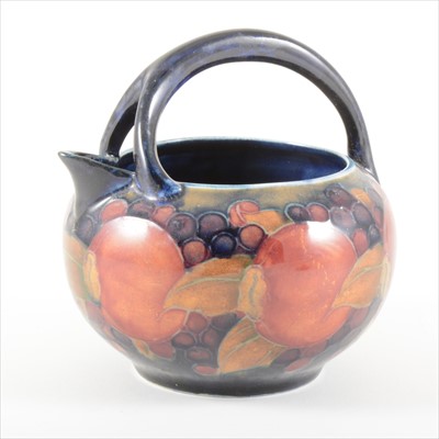 Lot 39 - A 'Pomegranate' design milk jug, by William Moorcroft, circa 1920.