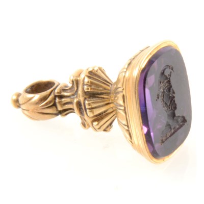 Lot 282 - A yellow metal seal with intaglio carved amethyst to base depicting a jester.