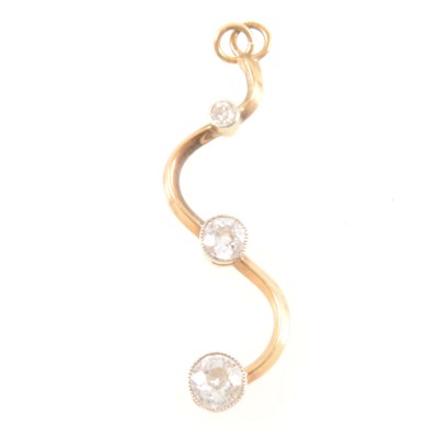 Lot 311 - A diamond three stone pendant.
