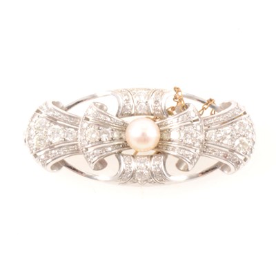 Lot 361 - A diamond and pearl brooch.