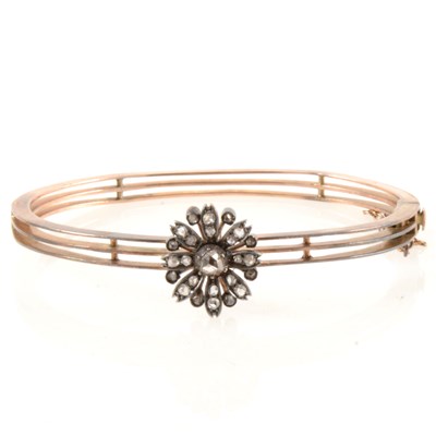 Lot 246 - A diamond set half hinged bangle.