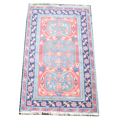 Lot 522 - A small modern Persian rug, three blue medallions