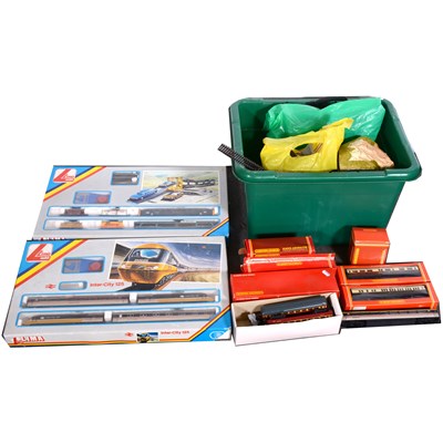 Lot 24 - OO gauge model railways; a collection including examples by Lima, Hornby, with track, buildings, accessories, and two larger Lima sets