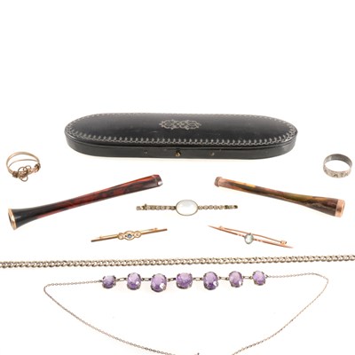 Lot 411 - Three cigarette holders, spectacle case and jewellery.