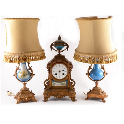 Lot 174 - A French gilt spelter mantel garniture, comprising clock,...
