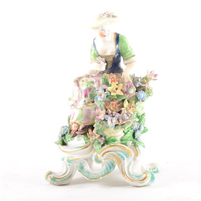 Lot 77 - A Derby figure of a young lady, with flowers, ...