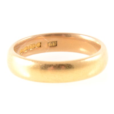 Lot 298 - A 22 carat yellow gold wedding band.