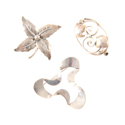 Lot 385 - Three Scandinavian white metal brooches.