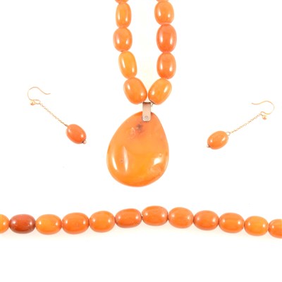Lot 328 - Two amber coloured bead necklaces.