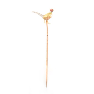 Lot 377 - A yellow and white metal pheasant stick pin.