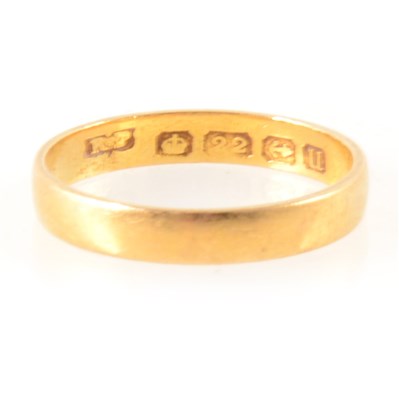 Lot 295 - A 22 carat yellow gold wedding band.