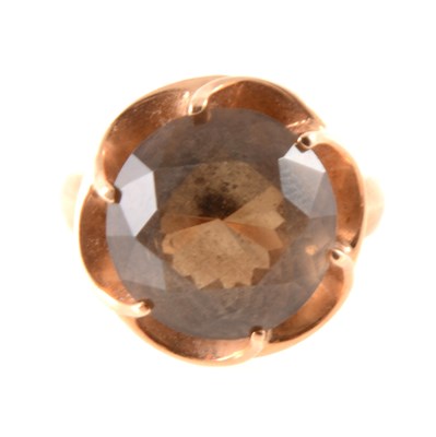Lot 277 - A smoky quartz dress ring.