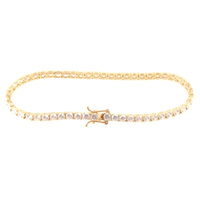 Lot 352 - A synthetic white stone tennis bracelet.