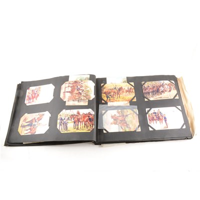 Lot 67 - A postcard album and contents, military related, ...