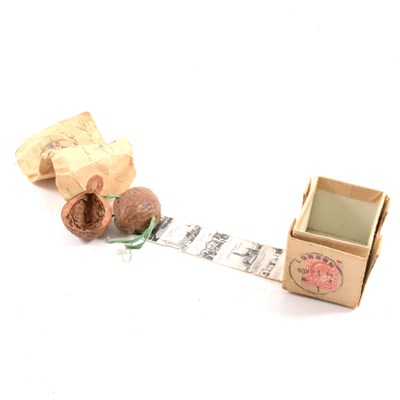 Lot 170 - "London in a nutshell" - a novelty photographic strip of London landmarks in a walnut shell