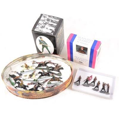 Lot 98 - A selection of flat metal military figures, a Britains Lifeguard Standard Bearrer on wooden plinth, boxed, and a Sharpe's series porcelain figure, boxed.