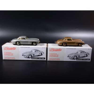 Lot 386 - Somerville 1:43 scale white metal models; two no.105 Mercedes-Benz 300SL, one in gold and one in silver, boxed.
