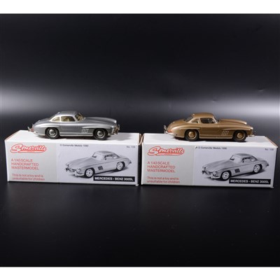 Lot 387 - Somerville 1:43 scale white metal models; two no.105 Mercedes-Benz 300SL, one in gold and one in silver, boxed.