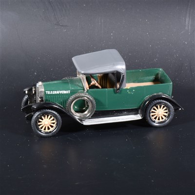 Lot 445 - A Somerville metal and wood mock-up prototype of a Volvo truck, painted green and black, with rubber tyres, 9.5cm.