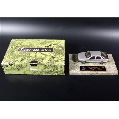 Lot 453 - A Somerville white metal model Saab 9000 Turbo 16 1984, a promotional desk piece made for the Saab Dealers, mounted on marble base with logo plague, 16cm by 9.5cm base, boxed.