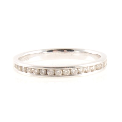 Lot 253A - A diamond half eternity ring.