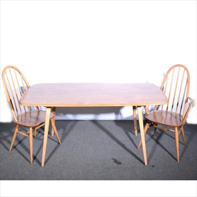Lot 262 - A light elm and beech dining table and six Quaker chairs by Ercol.