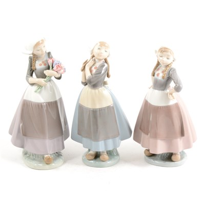 Lot 20 - Three Lladro models Dutch Girls, one with tulips, ...