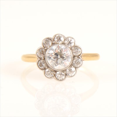 Lot 664 - A diamond circular cluster ring.