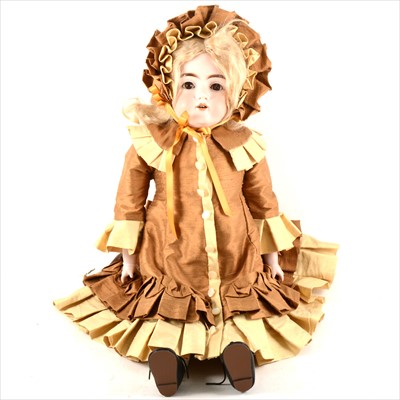 Lot 114 - A German bisque head doll, leather body, sleeping eyes, open mouth, 56cm