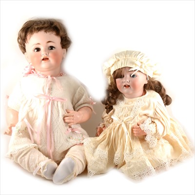 Lot 120 - Two German JDK Ketsner bisque head baby dolls, a boy and girl, composition bodies, fixed eyes, open mouth, (both with damages), 62cm and 52cm.