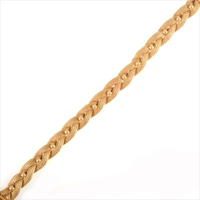 Lot 690 - A yellow metal plait bracelet.