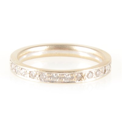 Lot 145 - A diamond full eternity ring.