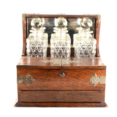 Lot 36 - An Edwardian oak tantalus box