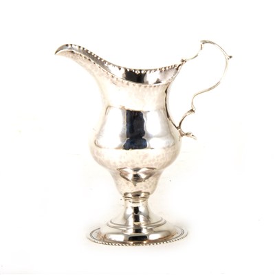 Lot 123 - A silver helmet shape cream jug, by Hester Bateman,London 1784.