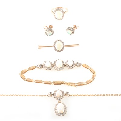 Lot 184 - A suite of opal jewellery - necklace, bracelet, brooch, earrings and ring.